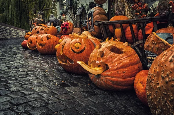 Self-carved pumpkins on the street as decoration for Halloween in Germany.
