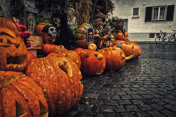 Self-carved pumpkins on the street as decoration for Halloween in Germany.