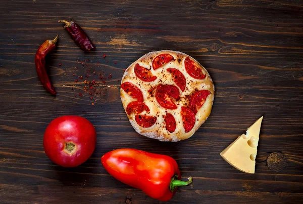 Homemade pizza Margarita and ingredients on wooden background, balanced food concept,copy space, closeup,isolated.Flat lay.