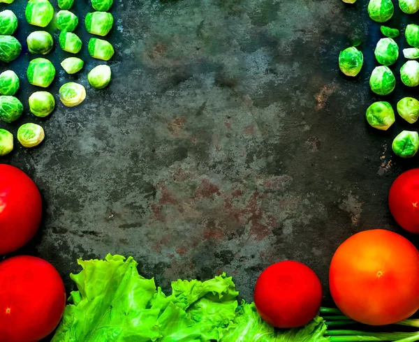 Fresh vegetables for healthy cooking on background of old rusty metals.