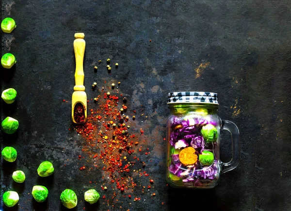 Salad of healthy vegetables in a glass jar on vintage rusty metal background. — Stock Photo, Image