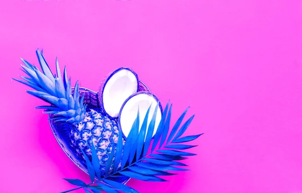 Tropical neon background with blue palm leaves. Trendy colors 2019.