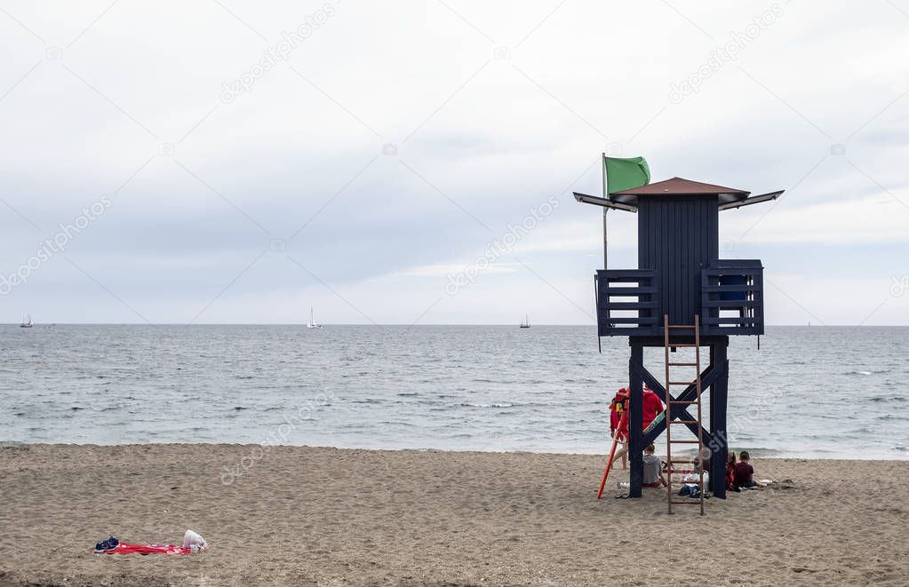 guard house with green flag of lifeguards on a Spanish beach