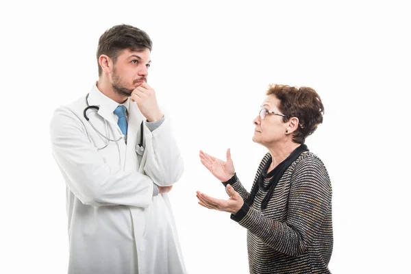 Female Senior Patient Explaining Something Male Doctor Isolated White Background — Stock Photo, Image