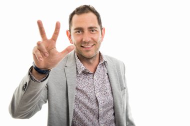 İş adamı gösteren boşaltmak reklam alan beyaz zemin üzerine izole üç numaralı portresi