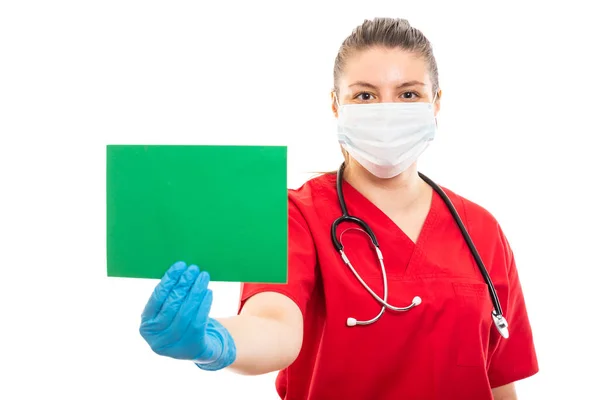 Portrait Young Medical Nurse Wearing Red Scrub Holding Green Cardboard — Stock Photo, Image