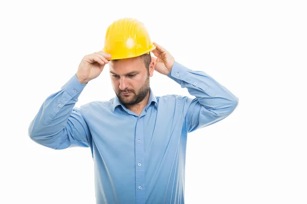 Portrait Young Architect Putting Yellow Helmet Isolated White Background Copyspace — Stock Photo, Image