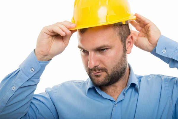 Close View Young Architect Putting Yellow Helmet Isolated White Background — Stock Photo, Image
