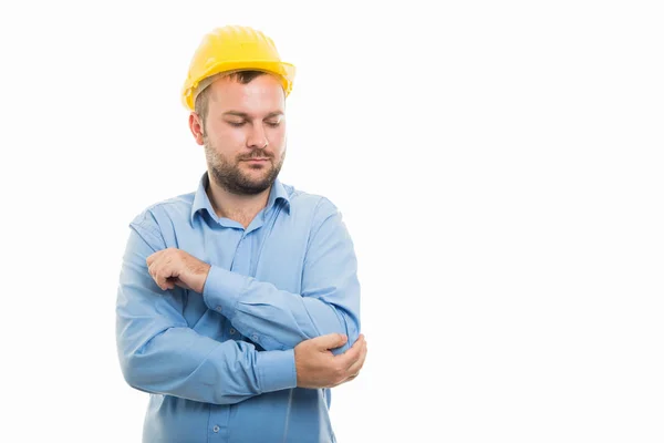 Portrait Young Architect Yellow Helmet Showing Elbow Pain Gesture Isolated — Stock Photo, Image