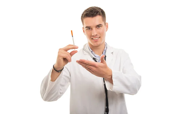 Portrait of young handsome doctor showing diabetes shot — Stock Photo, Image