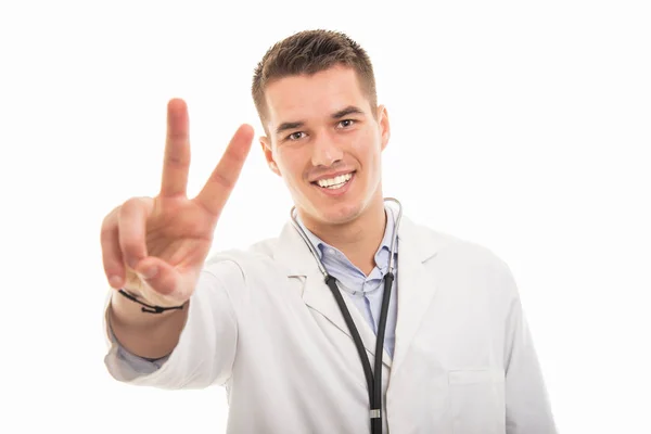 Portret van de jonge knappe dokter tonen vrede gebaar — Stockfoto