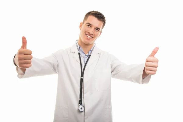 Retrato de un joven médico guapo mostrando doble gesto —  Fotos de Stock