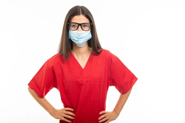 Portrait of beautiful young nurse wearing scrubs and face steril — Stock Photo, Image