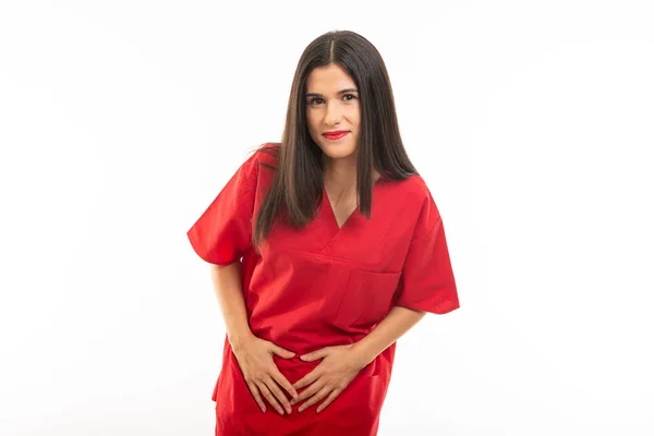 Porträt einer Krankenschwester, die Peelings trägt und Menstruationsschmerzen macht — Stockfoto