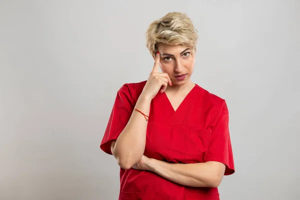 Portrait Young Attractive Female Nurse Making Thinking Gesture Grey Background — Stock Photo, Image