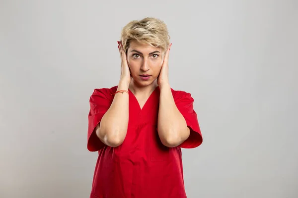 Portrait Young Attractive Female Nurse Covering Ears Deaf Gesture Grey — Stock Photo, Image