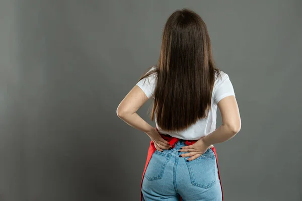 Back View Female Supermarket Employee Holding Lower Back Hurting Gray — Stock Photo, Image