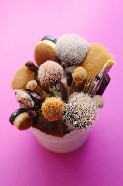 Make up brushes  on purple background