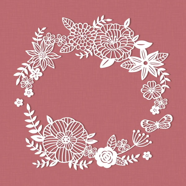 White paper cut flower wreath on pink background