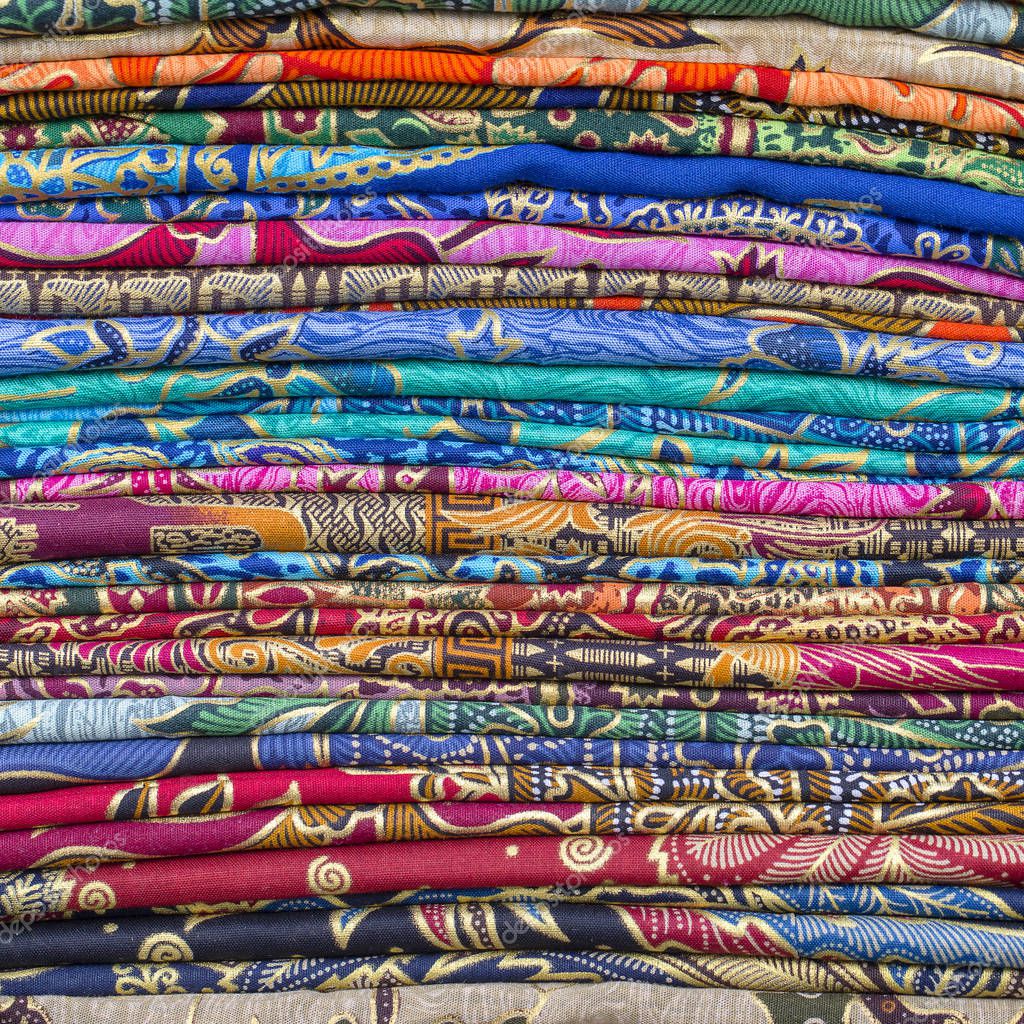 Assortment of colorful sarongs for sale in local market, Island Bali, Ubud, Indonesia. Close up