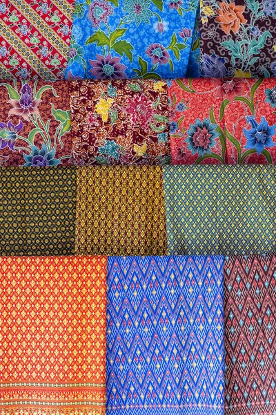 Colorful traditional sarongs for sale on street market in Thailand. Souvenirs for tourists at street market — Stock Photo, Image