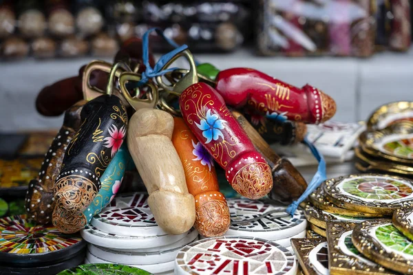 Wooden penises figures souvenir on display for sale to tourists on street local market in Ubud, island Bali, Indonesia — Stock Photo, Image