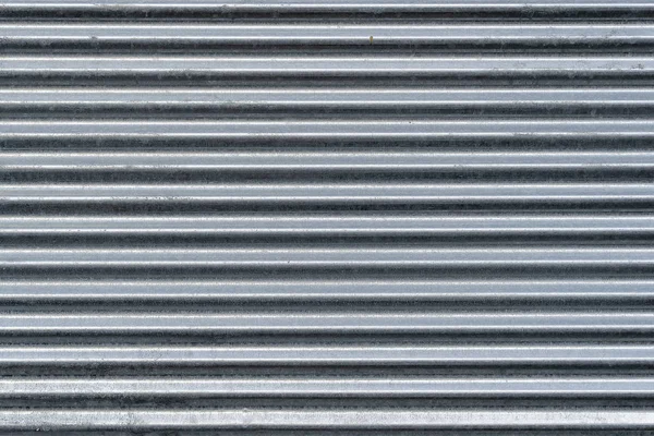 Struttura della parete in metallo, sfondo. Lamiera zincata a costine per strutture edili. È usato per coprire tetti per la costruzione di recinzioni — Foto Stock