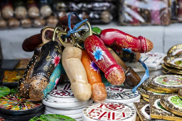 Wooden penises figures souvenir on display for sale to tourists on street local market in Ubud, island Bali, Indonesia — Stock Photo, Image