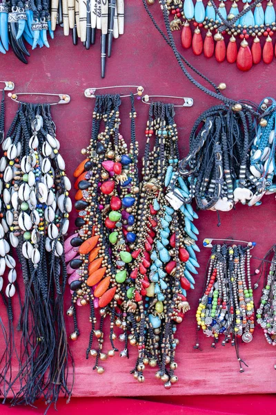 Colorful bracelets for sale on street at night market, Thailand. Souvenirs for tourists at market , close up — Stock Photo, Image