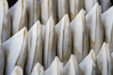 Potato samosa for sell at street food market in island Koh Phangan, Thailand , closeup clipart