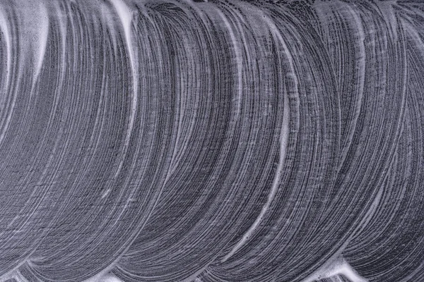 Αφηρημένη υφή αφρού σε μαύρο φόντο. Φυσαλίδες αφρού σαπουνιού αφηρημένο σκούρο φόντο — Φωτογραφία Αρχείου
