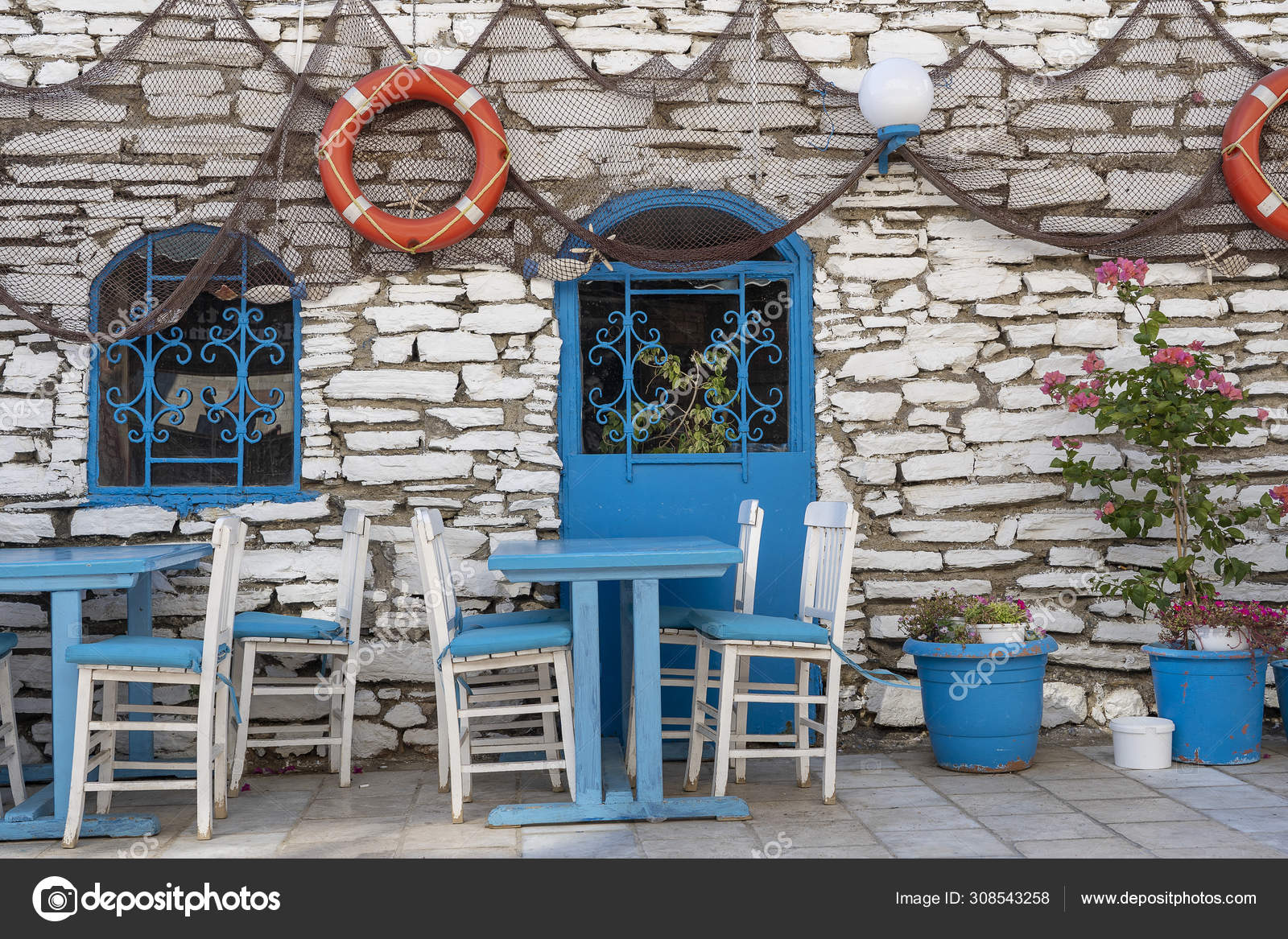 Traditional Greek Outdoor Restaurant With Mediterranean Sea View