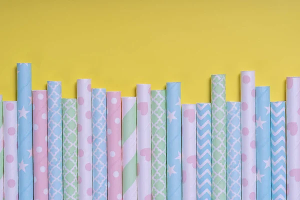 Background for a banner with paper tubes isolated on yellow background. Frame for a banner with cocktail tubes. Party banner, cocktails bar. Elegant paper drinking straws