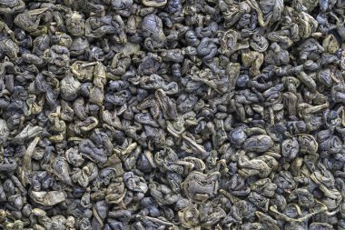 Yeşil çay yaprakları arka planda. Oolong çayı. Soyut gıda dokuları. Yakın plan. Çin 'in en kaliteli çayı..