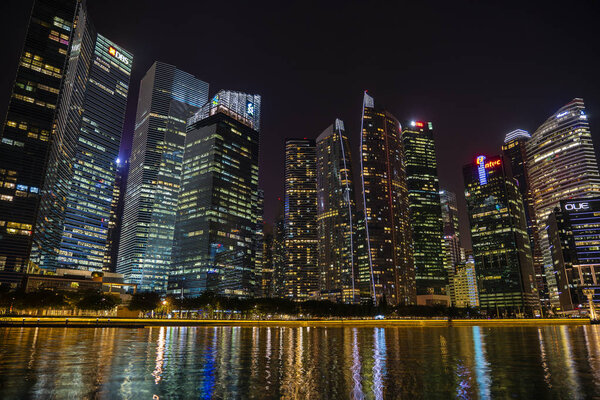 Singapore city, Singapore - march 28, 2019 : Singapore Skyline and view of skyscrapers on Marina Bay at night . Singapore cityscape of the financial district