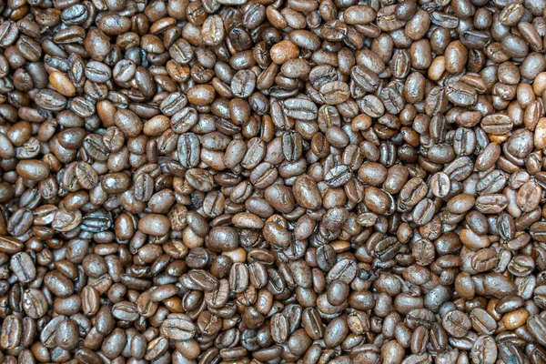 Chicchi Caffè Tostati Uno Sfondo Avvicinamento Vista Dall Alto — Foto Stock