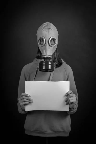 Girl Gas Mask Black Background Holds White Sheet Close Black — Stock Photo, Image