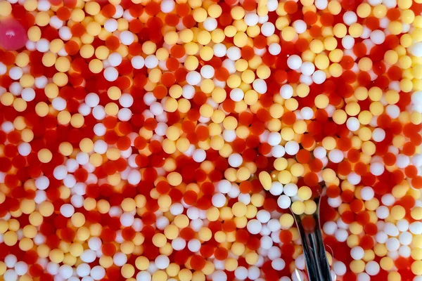 Sweetmeat with colorful ball flour , Thai style food. Street food in local market, Thailand. Thai dessert with colorful ball flour, is one of Thai snack that usually will eat with coconut milk.