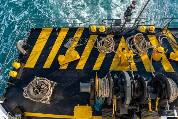 Yellow Black Painted Ferry Deck Boat Thick Mooring Rope Blue — стоковое фото