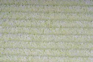 Ev temizlik süngerleri kapanıyor. Sünger detay dokusu, sünger dokusu arkaplanı kapat. Selüloz yeşil sünger dokusu. Sünger yüzey arka planında tel örgüsü