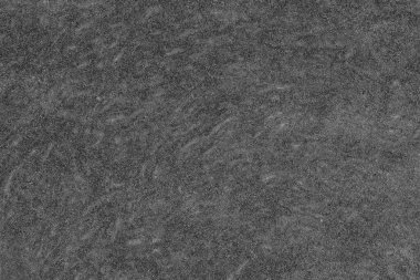 Balkabağı hamuru dokusuyla ikiye bölünmüş. Balkabağı dilimleri arka planda, yakın plan, üst manzara. Siyah ve beyaz