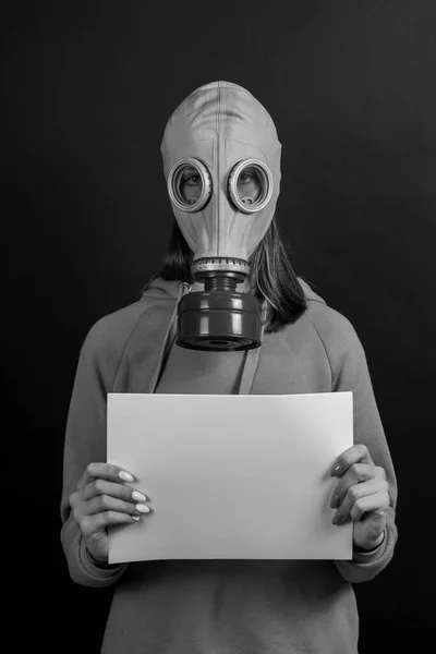 Girl Gas Mask Black Background Holds White Sheet Close Black — Stock Photo, Image