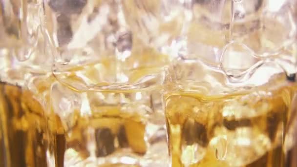 Slow motion pour a drink into a glass close-up — Stock Video