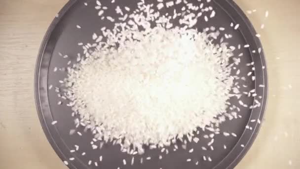 Slow motion white long grain rice drops down — Stock Video