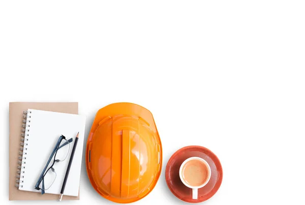 Top view with orange safety engineer helmet,glasses,cup of coffee and blank notebook or notepad and pencil on white background or office desk background.