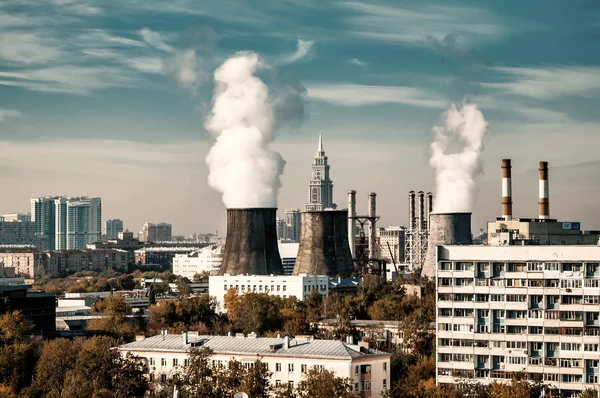 Coal fired power station with cooling towers. Cityscape