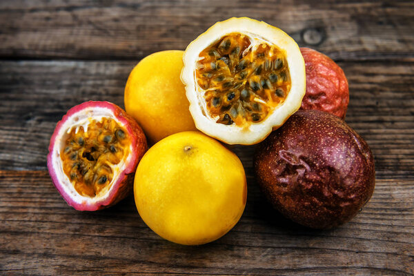 heap of delicious passion fruit on wooden background