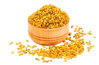 Tahta kasede beyaz üzerinde arı poleni