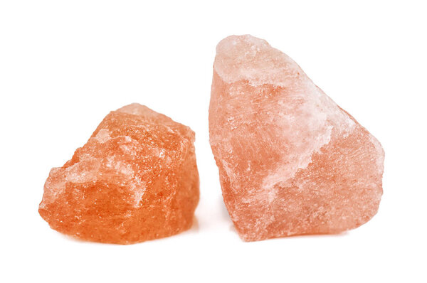 crystals of pink Himalayan salt on white