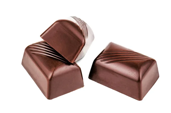 Drei Schokoladenbonbons auf weiß — Stockfoto